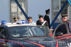 Gli arrestati escono dalla caserma dei carabinieri di Viterbo