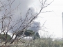 Isola ecologica in fiamme
