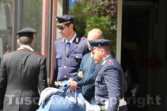 Gli arrestati escono dalla Questura, diretti a Mammagialla