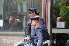 Gli arrestati escono dalla Questura, diretti a Mammagialla