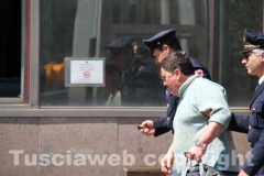 Gli arrestati escono dalla Questura, diretti a Mammagialla