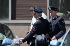 Gli arrestati escono dalla Questura, diretti a Mammagialla