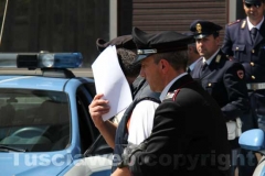 Gli arrestati escono dalla Questura, diretti a Mammagialla