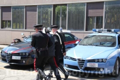 Gli arrestati escono dalla Questura, diretti a Mammagialla