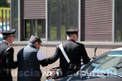 Gli arrestati escono dalla Questura, diretti a Mammagialla