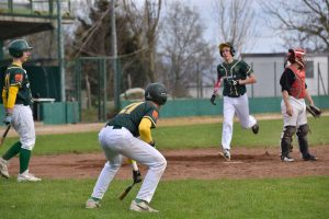 Sport - Baseball - Wiplanet Montefiascone - Manzi segna il punto seguito da Tabarrini e Pacchiarelli